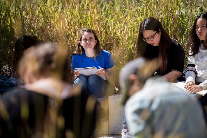 In spring and fall students attend a class outdoors in the garden near the Sanger Center for the Sciences.